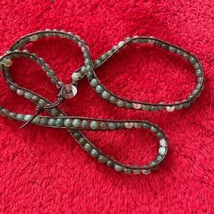 Leather bracelet with green mineral gems